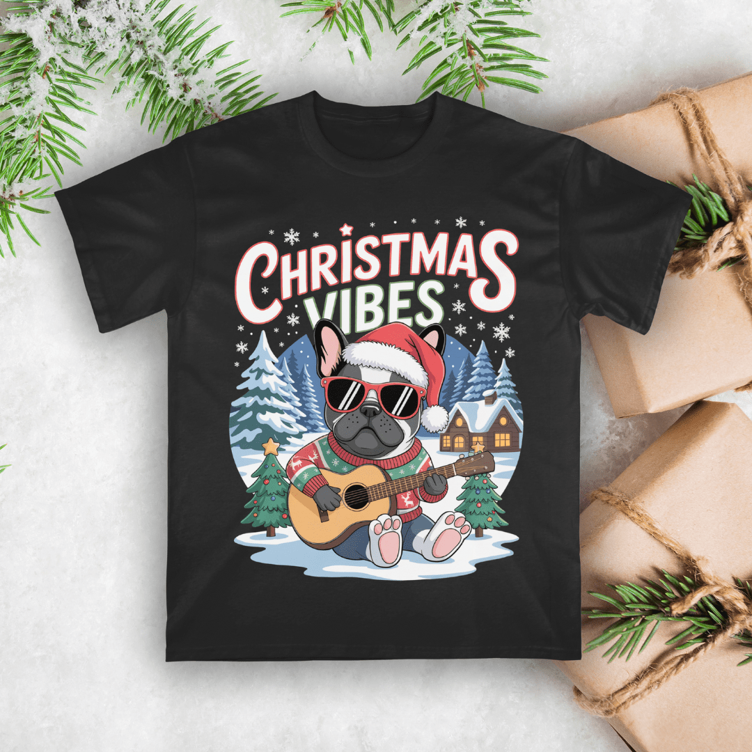 Black t-shirt with a Christmas-themed design featuring a dog playing guitar and text 'Christmas Vibes' on a snowy background.