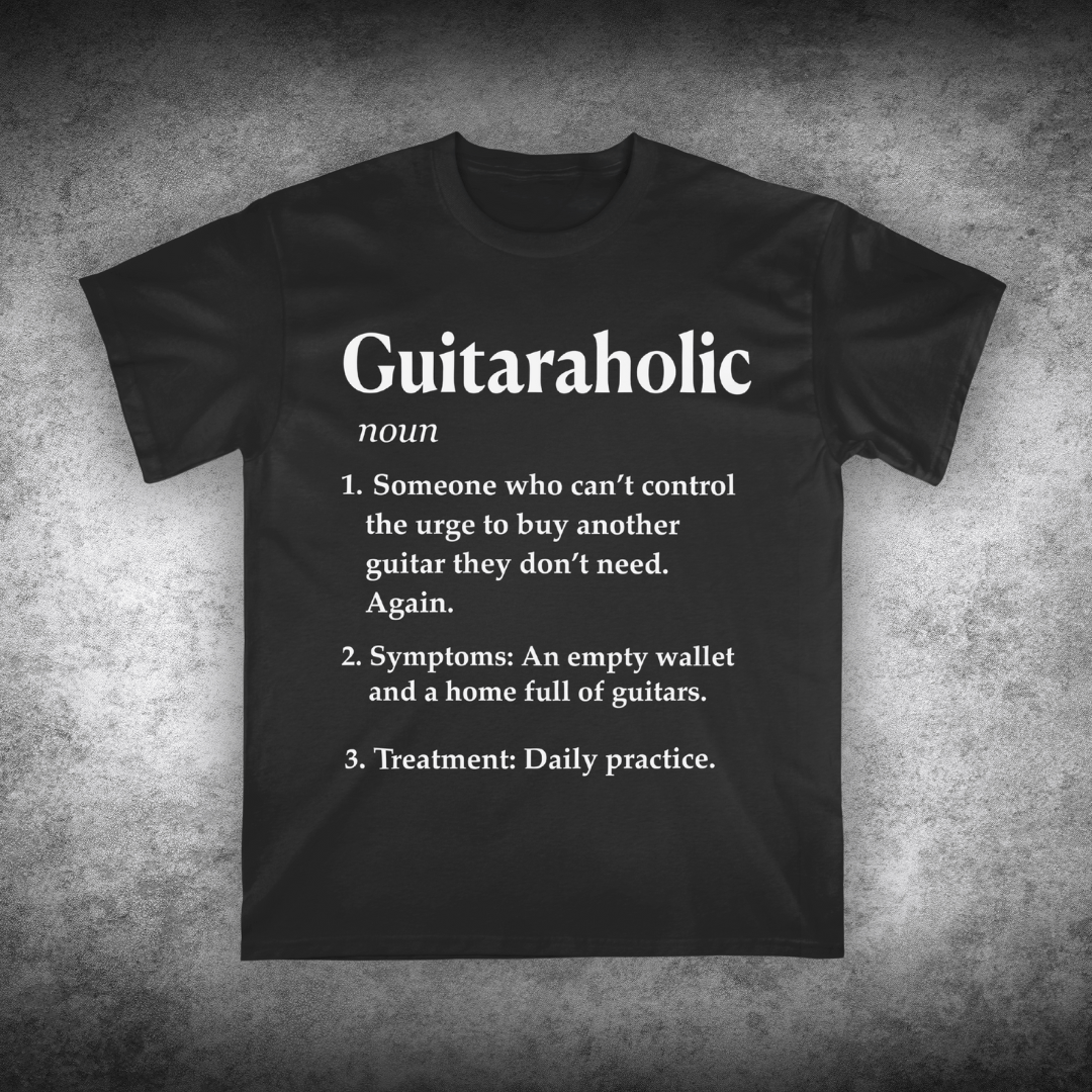 Black t-shirt with 'Guitaraholic' definition text on a textured gray background