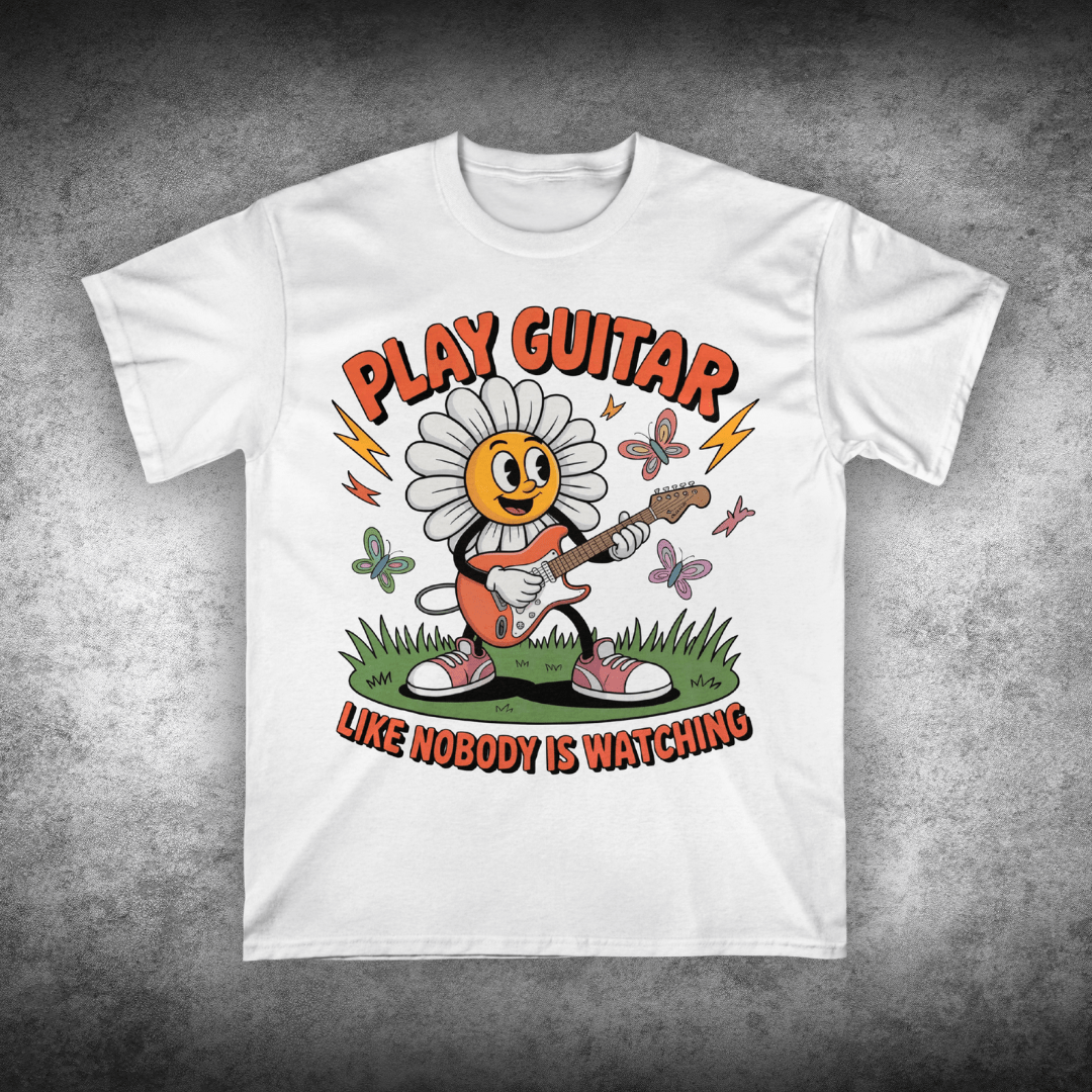 White t-shirt with a cartoon character playing guitar and text on a gray background