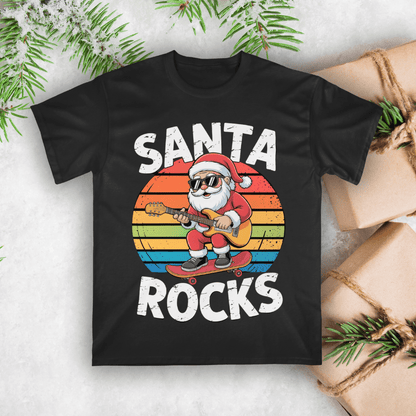 Black t-shirt with Santa playing guitar and 'Santa Rocks' text on a white background with Christmas decorations.