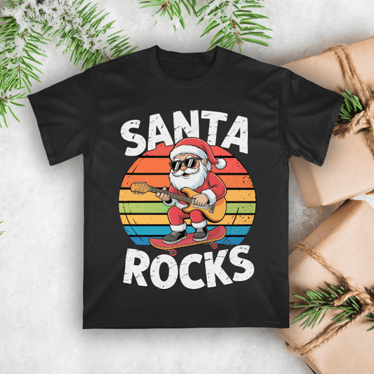Black t-shirt with Santa playing guitar and 'Santa Rocks' text on a white background with Christmas decorations.