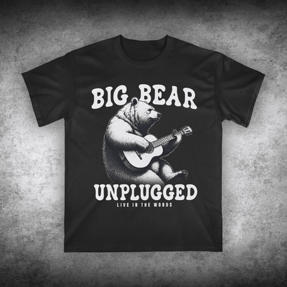 Black t-shirt with a bear playing guitar graphic and text on a textured gray background