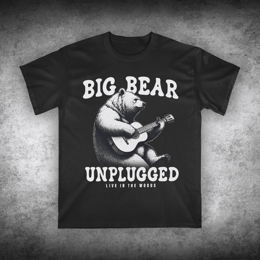 Black t-shirt with a bear playing guitar graphic and text on a textured gray background