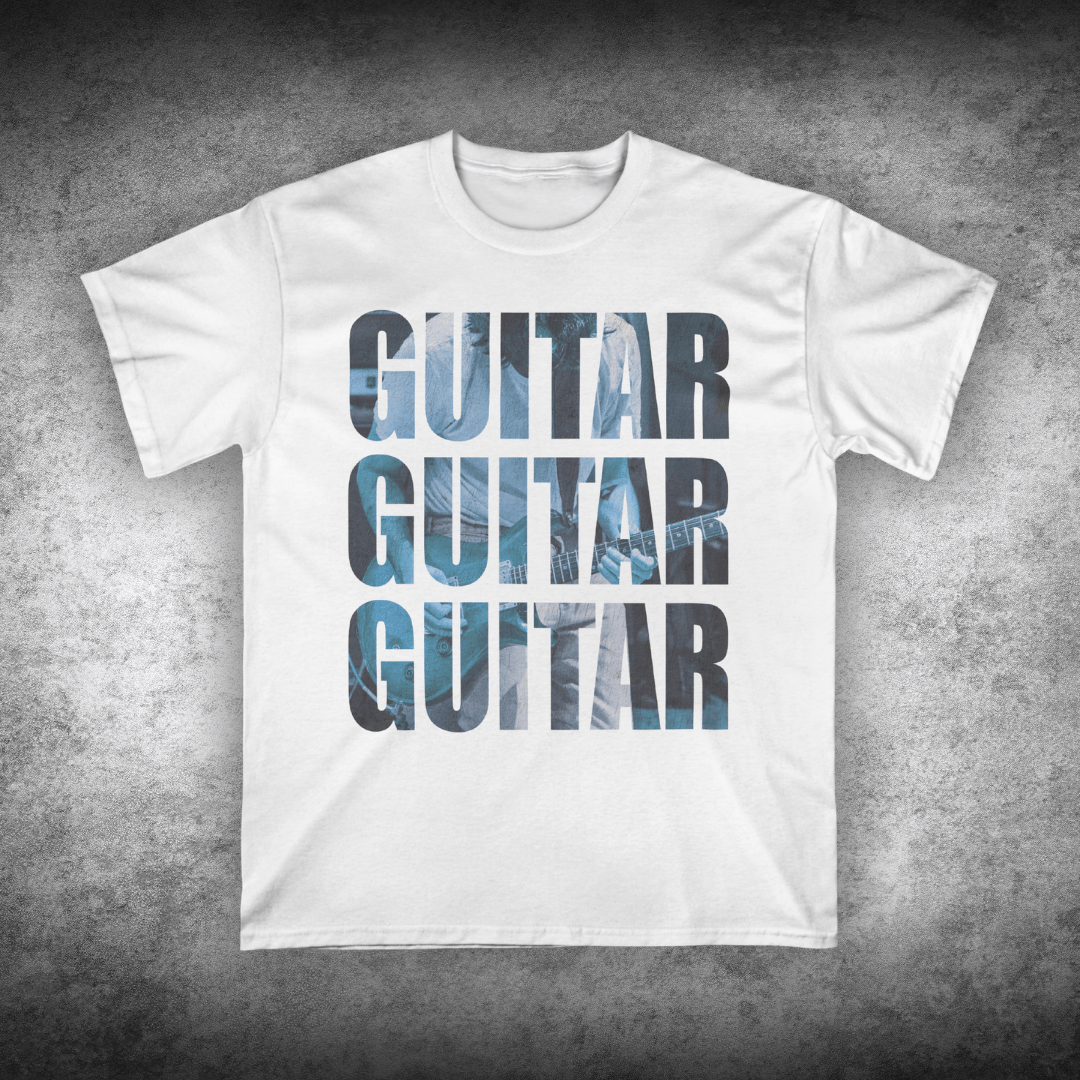 White t-shirt with 'GUITAR' text design on a textured gray background