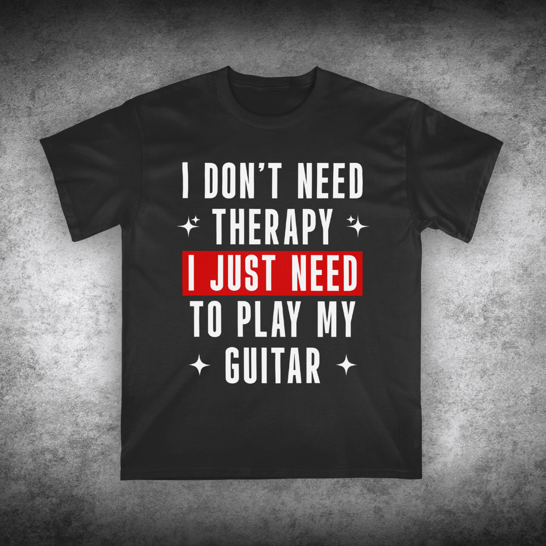 Black t-shirt with text 'I don't need therapy, I just need to play my guitar' on a textured gray background
