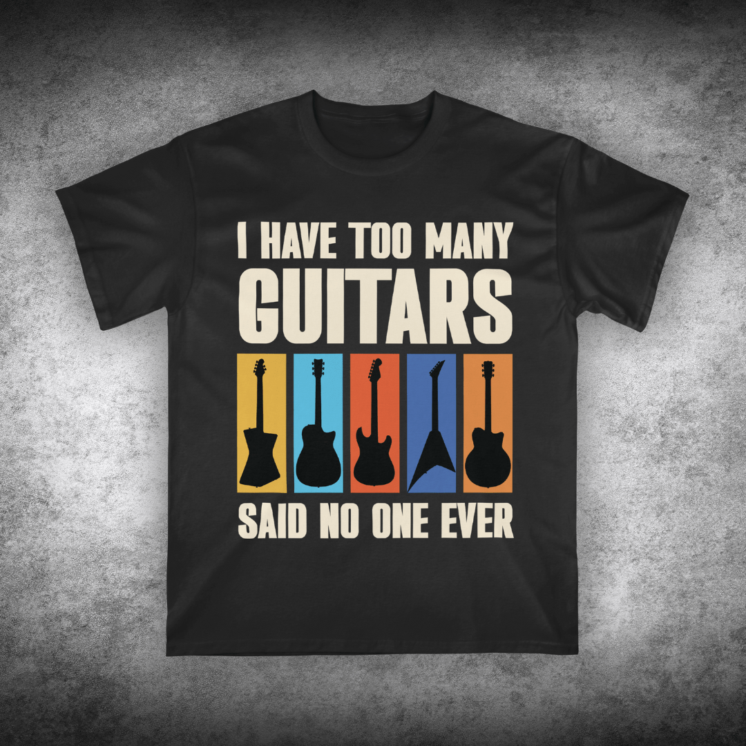 Black t-shirt with guitar graphic and text on a textured gray background
