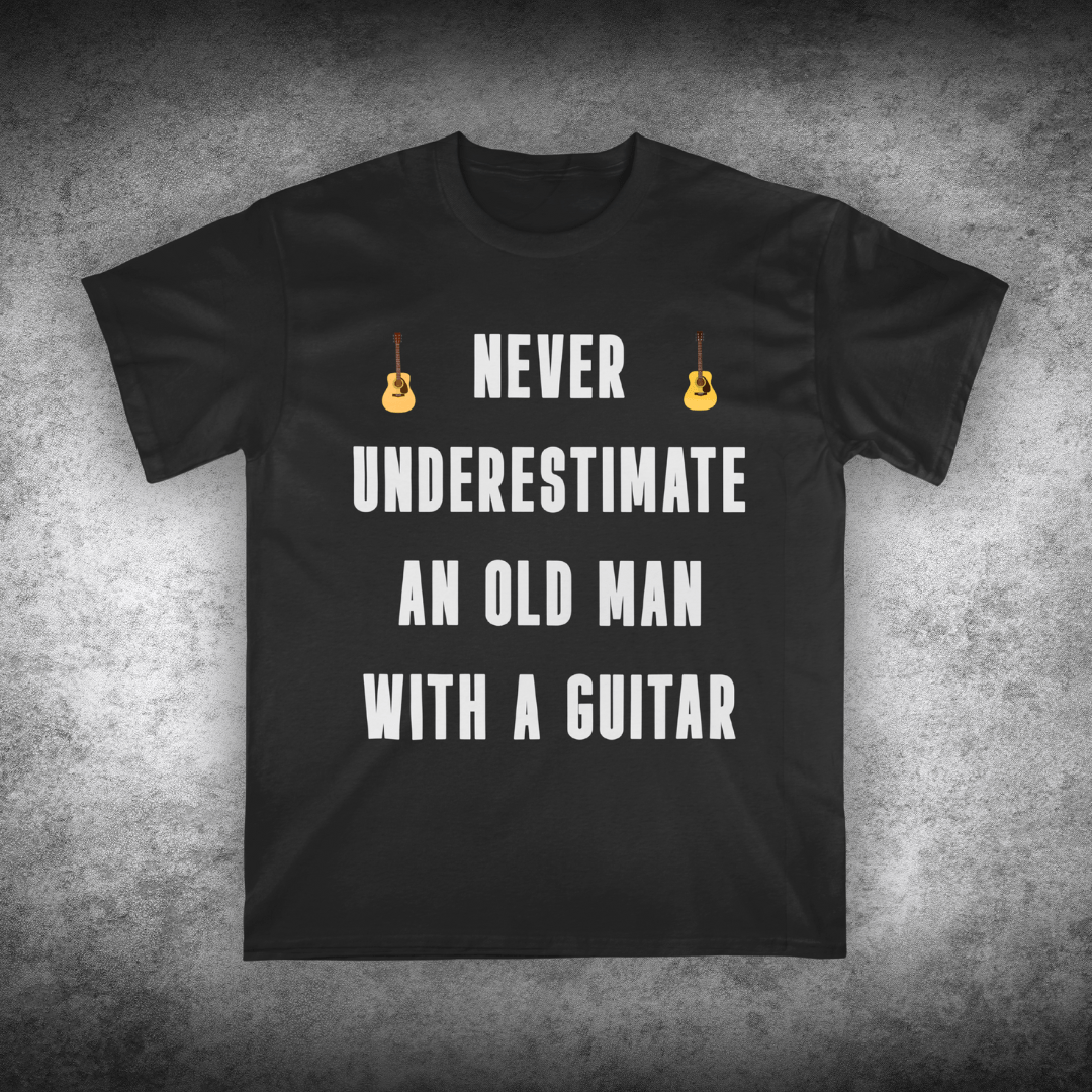 Black t-shirt with white text and guitar graphics on a textured gray background