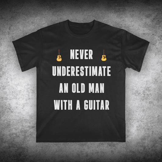 Black t-shirt with white text and guitar graphics on a textured gray background